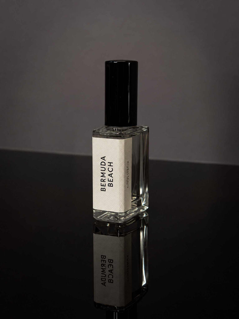 Bermuda Beach Wearable Fragrance in a clear rectangular glass bottle with a black cap and minimalist white label