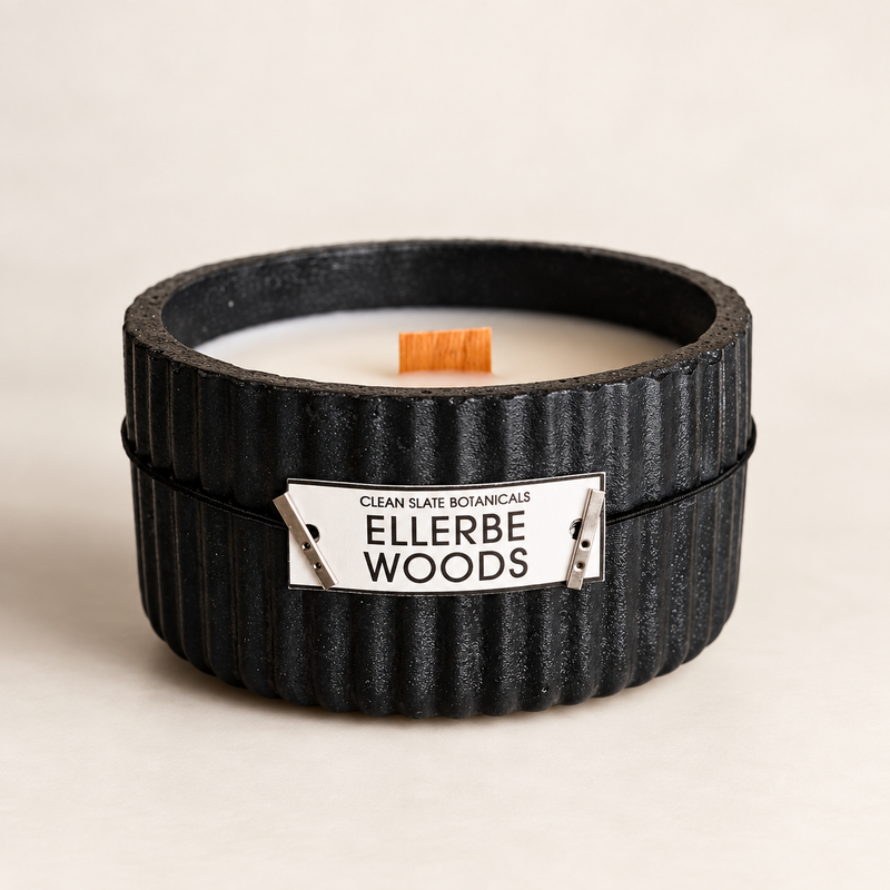 Ellerbe Woods Candle in a black artisan concrete ribbed vessel with wood wick and white soy wax