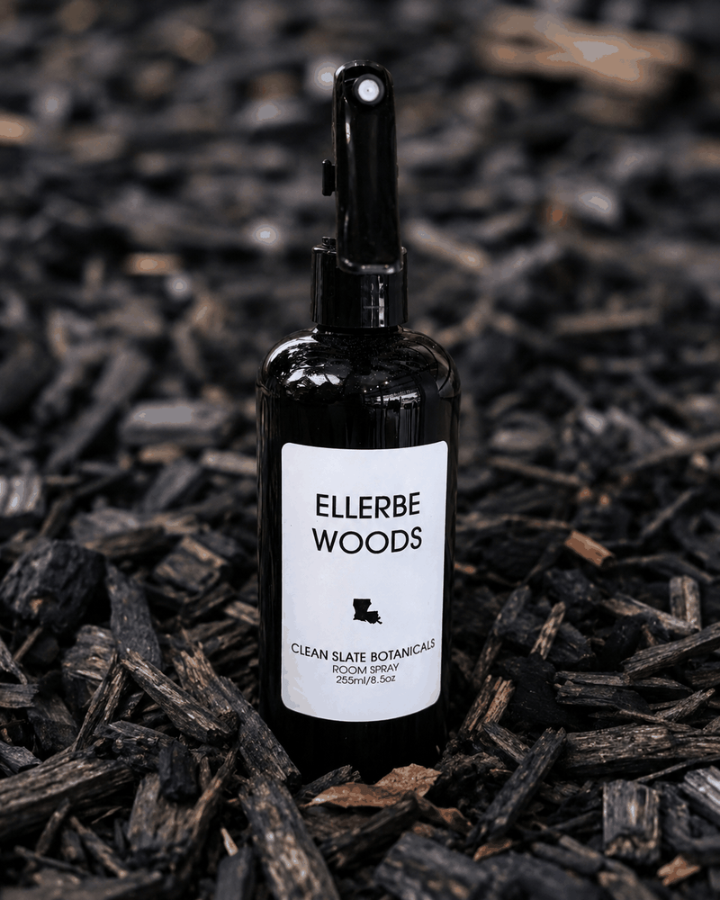 Ellerbe Woods Room Spray in a black glass bottle with a white label and black fine-mist sprayer